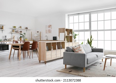 Interior of stylish living room with bookshelf - Shutterstock ID 2113072388