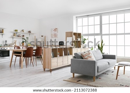 Interior of stylish living room with bookshelf