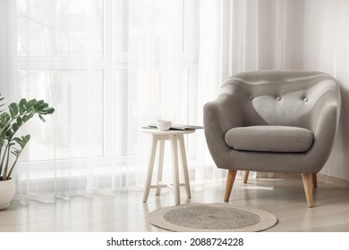 Interior of stylish living room with light curtains - Shutterstock ID 2088724228