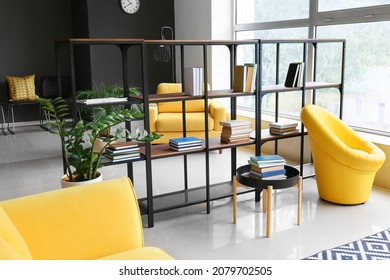 Interior of stylish living room with modern bookshelf - Shutterstock ID 2079702505