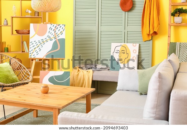 Interior of stylish\
living room with\
pictures