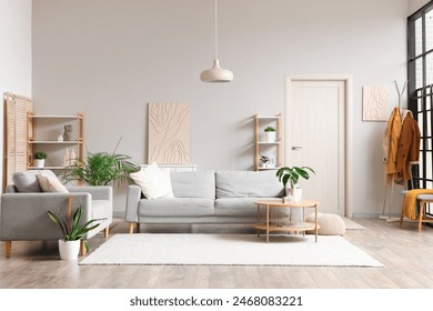 Interior of stylish modern living room with grey sofas and houseplants - Powered by Shutterstock