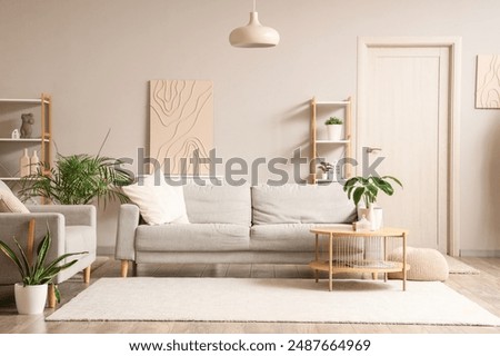 Similar – Image, Stock Photo Modern living room with natural light and cozy decor