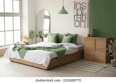 Interior of stylish room with big bed and mirror - Shutterstock ID 2155309775