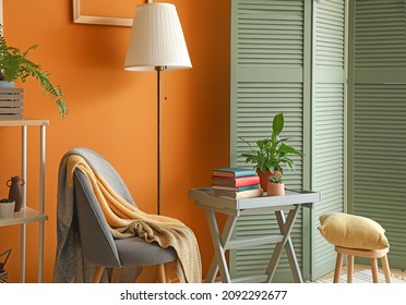 Interior of stylish room with folding screen