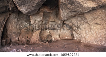 Interior of Sumbay Cave. The walls are covered by rupestrian rock art (hunters, animals) from paleolithic era (6000-8000 BC), Arequipa departement, Southern Peru	
