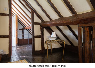 Interior of a traditional, furnished English cottage in Yorkshire. Wooden beams on wall and roof. - Shutterstock ID 1811744488