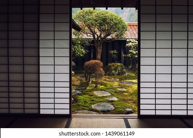 Interior Of Traditional Japanese House With Rice Paper Doors And Beautiful Garden At Tsumago Juku, Kiso Valley, Japan.