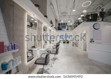 Similar – Image, Stock Photo In the hair salon, a moody enchantress, dressed in chic business attire, radiated beauty is thinking about things. A gorgeous girl might be waiting for a client. A true professional makeup artist alone in her thoughts.