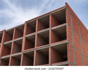 Interior Of A Unfinished Red Brick House Under Construction. Close Up Windows.