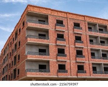 Interior Of A Unfinished Red Brick House Under Construction. Close Up Windows.