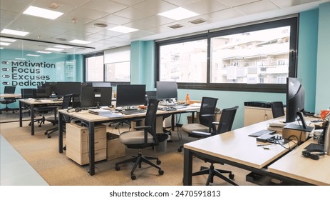 Interior of unorganized creative workspace with computer desks