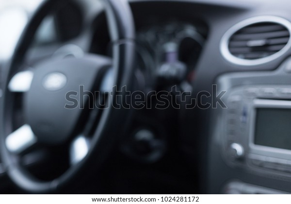 Interior of the vehicle speedometer panel and\
steering wheel with focus on some\
parts