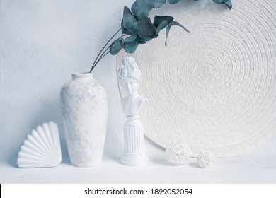 Interior Vertical Still Life In Pastel Colors. Minimalist Trendy Style. Comfort And Harmony In Home Design And Decor. Decorative Plaster Trinkets, Napkin, Vase With Eucalyptus Leaves.