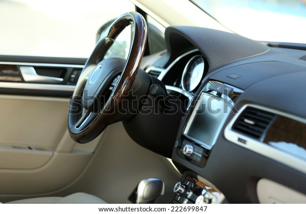 Interior\
view of car with beige salon and black\
dashboard