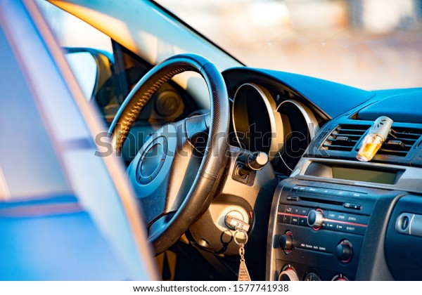 Interior view of\
car focus on the steering\
wheel