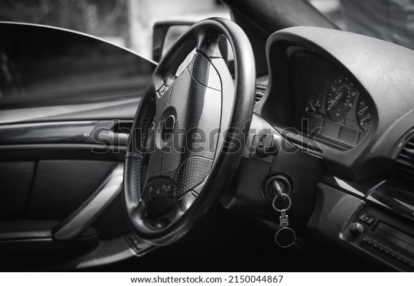 Interior view of\
car. Luxury car steering\
wheel