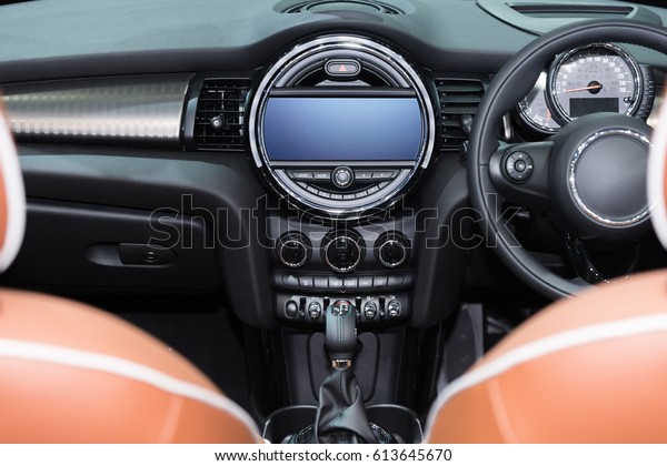 Interior view of car. Modern\
technology car dashboard, radio and aircondition control\
button.