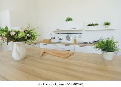 Interior View Of Elegant Minimalist Kitchen And Dining Area. No People.