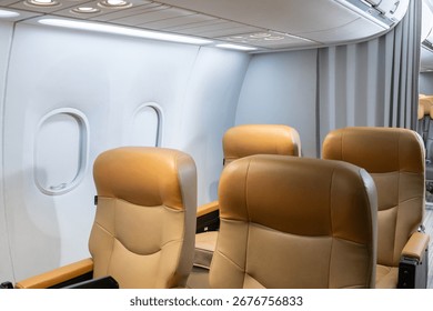 Interior view of empty airplane cabin featuring brown leather seats, closed overhead bins, and natural light through windows.