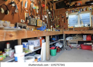 Interior View Of Home Garage Workshop With Work Surface And Working Tools. Working Place Background. No People. Copy Space