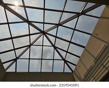 An interior view of a large glass ceiling. - Powered by Shutterstock