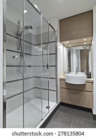 Interior View Of A Modern Bathroom With Glass Shower Cubicle