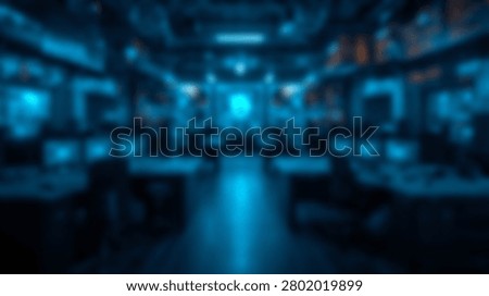 Interior view of a modern futuristic control room with multiple screens and glowing blue ambient lighting, suggesting advanced technology and data monitoring.