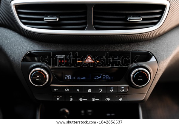 Interior view of a modern new car. Climatronic or\
air conditioner\
system.