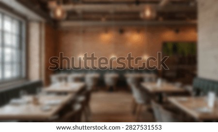 Interior view of a modern restaurant dining area with tables set and chairs arranged, awaiting patrons.