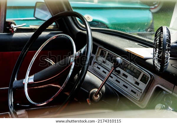 Interior view of old vintage car. View on dashboard\
of classic car.