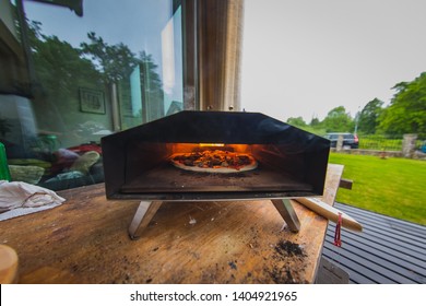 Interior View Of A Pellet Fired Home Pizza Oven In A Garden. Fresh Delicious Pizza Is Seen Inside The Oven