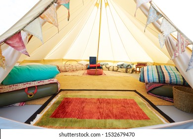 Interior View Of Teepee Tent Pitched On Glamping Camp Site With No People