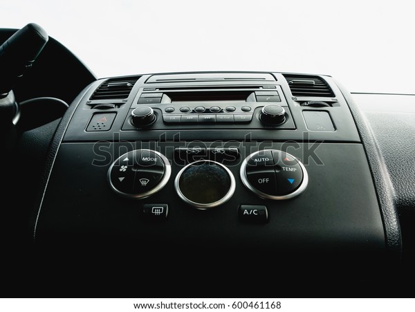 Interior view of vehicle.\
Modern technology car dashboard close up. Climate control and car\
audio panel.