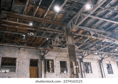 Interior wall and ceiling of an old decaying abandoned warehouse building in New Orleans, Louisiana, USA