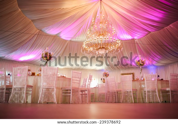 Interior of
a wedding tent decoration ready for
guests