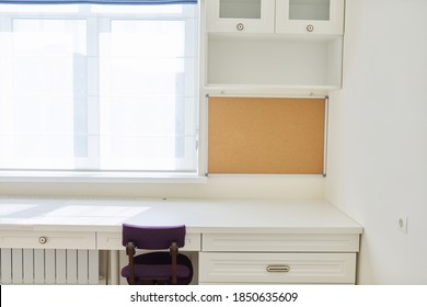 Interior, White Furniture, Table And Chair Near The Window, Cork Board On The Wall. Workplace In Children's Room, In Home Office, Modern Classic Style, Ergonomic Orthopedic Knee Chair