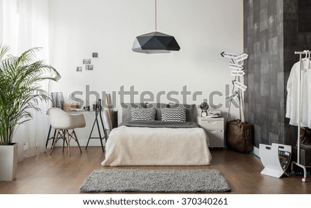 Interior of white and gray cozy bedroom