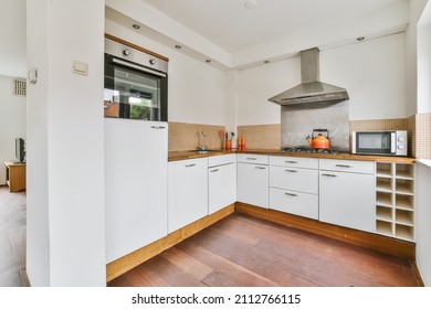 Interior Of The White Kitchen With All Equipments