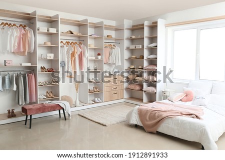 Interior of white modern bedroom with wardrobe