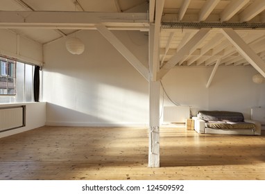 interior wide loft, beams and wooden floor