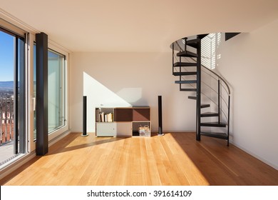 Interior, wide open space of a duplex, parquet floor