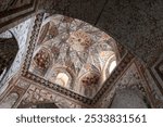 Interior of the winter mosque of Abdulaziz Khan Madrasah, an ancient madrassah in Bukhara, Uzbekistan. It was built in 1652-1654. Decorated Ceiling