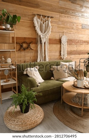 Interior of witchs room with magic attributes, sofa and table