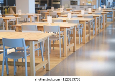Interior of wooden table in food court shopping mall. Food center in department store.