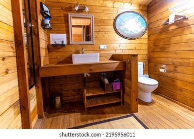 Interior Of A Wooden Toilet In Rustic Colonial Style