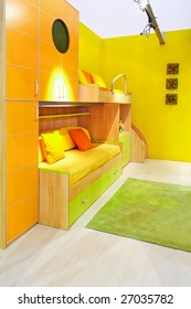 Interior Of Yellow Kids Room With Bunk Beds