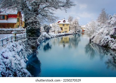 Interlaken idyllic landscape after snow in winter with river reflection, Swiss alps, Switzerland - Powered by Shutterstock