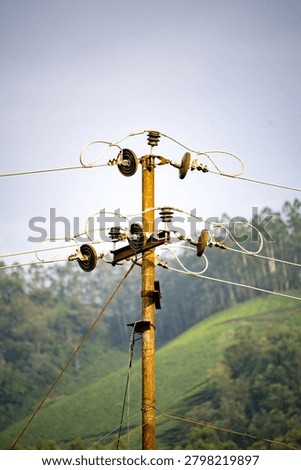 Interlinked electric lines connected in a GI electric post with multiple insulators 