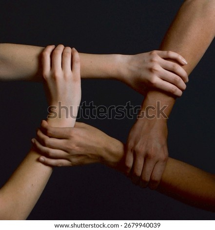 Interlocked hands of two people in unity